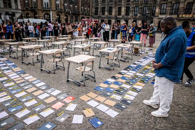 August 15, 2026, Amsterdam, North Holland, The Netherlands Holland: Notebooks and pens are set out as a call for education freedom in Afghanistan. August 15, 2026, Amsterdam, The Netherlands. Demonstrators gathered on Dam Square, Amsterdam, in solidarity with Afghan women and girls. The protest marked five years of Taliban rule and demanded access to education for women and girls be restored, and an end to Brussels engagement with the Taliban regime. Amsterdam The Netherlands Holland  - ZUMAp202 20260815_zip_p202_005 Copyright: xJamesxPetermeierx