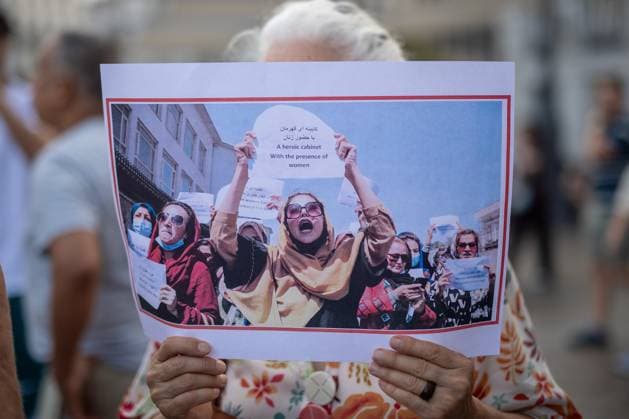 August 15, 2026, Madrid, Spain: A woman carries a banner during a rally in Madrid s Puerta del Sol, Afghan women asylum seekers and feminist groups gathered to commemorate the five-year anniversary of the Taliban s return to power in Afghanistan, following the withdrawal of US and NATO troops and the resulting setbacks in human rights and the rise of gender apartheid. Madrid Spain - ZUMAs197 20260815_aaa_s197_097 Copyright: xDavidxCanalesx