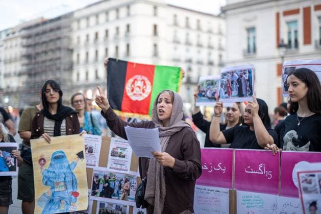 August 15, 2026, Madrid, Spain: A woman holds a banner while speaking during a rally in Madrid s Puerta del Sol, Afghan women asylum seekers and feminist groups gathered to commemorate the five-year anniversary of the Taliban s return to power in Afghanistan, following the withdrawal of US and NATO troops and the resulting setbacks in human rights and the rise of gender apartheid. Madrid Spain - ZUMAs197 20260815_aaa_s197_107 Copyright: xDavidxCanalesx