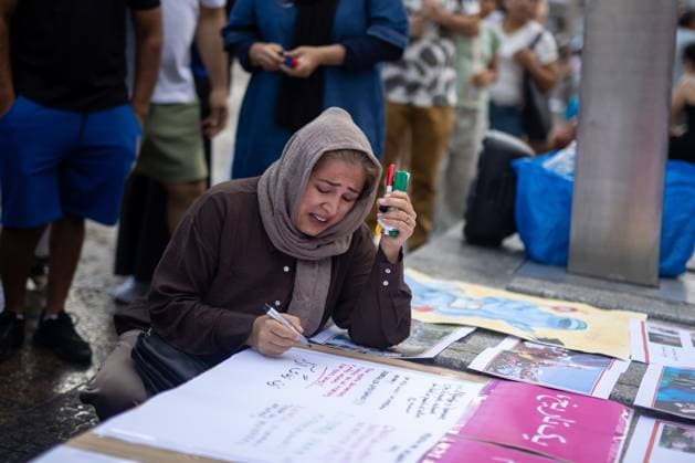 August 15, 2026, Madrid, Spain: MADRID, SPAIN Ã¢â‚¬ AUGUST 15, 2026: Afghan women, asylum seekers and feminist groups gather at Puerta del Sol in Madrid, Spain, on August 15, 2026, to mark five years since the Taliban returned to power in Afghanistan following the withdrawal of U.S. and NATO forces. Demonstrators denounced restrictions imposed on women and girls under Taliban rule and called for international action to defend their rights, describing the system of restrictions as Ã¢â‚¬oegender apartheid. Madrid Spain - ZUMAq101 20260815_zna_q101_134 Copyright: xC.xCarvajalx