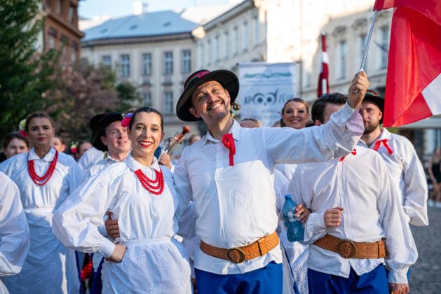 (260815) -- PRAGUE, Aug. 15, 2026 -- People take part in a parade during the Summer Folklore Festival in Prague, the Czech Republic, Aug. 15, 2026. The Summer Folklore Festival was held in Prague on Saturday, bringing together international folklore ensembles presenting their traditional dances, music and costumes. (Photo by Xinhua) CZECH REPUBLIC-PRAGUE-FOLKLORE FESTIVAL DanaxKesnerova 