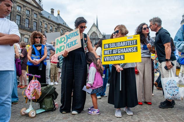 August 15, 2026, Amsterdam, Netherlands: Protesters hold placards during the rally. On the fifth anniversary of the Taliban™s capture of Kabul, in Afghanistan, several organizations held a demonstration to demand that the Netherlands and the EU stop legitimizing the Taliban and prioritize the rights of Afghan women. Under the Taliban, girls are barred from education beyond primary school, and women are banned from many jobs. There are laws dictating that women must cover their faces in public and forbidding them from entering public parks. Human rights groups call it gender apartheid. Amsterdam Netherlands - ZUMAs197 20260815_aaa_s197_139 Copyright: xAnaxFernandezx
