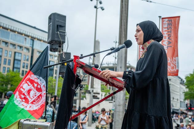 August 15, 2026, Amsterdam, Netherlands: An Afghan woman studying in the Netherlands is giving a speech during the rally. On the fifth anniversary of the Taliban™s capture of Kabul, in Afghanistan, several organizations held a demonstration to demand that the Netherlands and the EU stop legitimizing the Taliban and prioritize the rights of Afghan women. Under the Taliban, girls are barred from education beyond primary school, and women are banned from many jobs. There are laws dictating that women must cover their faces in public and forbidding them from entering public parks. Human rights groups call it gender apartheid. Amsterdam Netherlands - ZUMAs197 20260815_aaa_s197_141 Copyright: xAnaxFernandezx