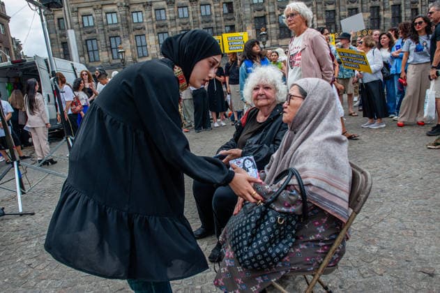 August 15, 2026, Amsterdam, Netherlands: Two Afghan women are chatting before the protest started. On the fifth anniversary of the Taliban™s capture of Kabul, in Afghanistan, several organizations held a demonstration to demand that the Netherlands and the EU stop legitimizing the Taliban and prioritize the rights of Afghan women. Under the Taliban, girls are barred from education beyond primary school, and women are banned from many jobs. There are laws dictating that women must cover their faces in public and forbidding them from entering public parks. Human rights groups call it gender apartheid. Amsterdam Netherlands - ZUMAs197 20260815_aaa_s197_142 Copyright: xAnaxFernandezx