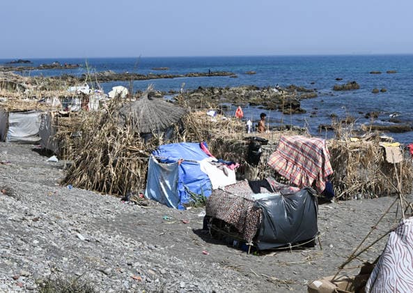 (260815) -- CEUTA, Aug. 15, 2026 -- Makeshift shelters are seen on Trampolin Beach in Ceuta, Spain, Aug. 15, 2026. More than 72,000 migrants crossed irregularly into Ceuta from neighboring Morocco on July 30 and 31, according to the Spanish government. Most returned to Morocco later, while thousands remain in the enclave.Security was also tightened along the border ahead of Saturday after calls for another mass crossing circulated on social media. Moroccan security forces intercepted hundreds of migrants attempting to reach the border area, while Ceuta reported no influx on a scale comparable to that seen in late July. ) SPAIN-CEUTA-VIEW ChengxMin 