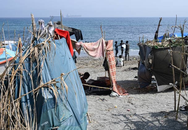 (260815) -- CEUTA, Aug. 15, 2026 -- Irregular migrants are seen in Ceuta, Spain, Aug. 15, 2026. More than 72,000 migrants crossed irregularly into Ceuta from neighboring Morocco on July 30 and 31, according to the Spanish government. Most returned to Morocco later, while thousands remain in the enclave.Security was also tightened along the border ahead of Saturday after calls for another mass crossing circulated on social media. Moroccan security forces intercepted hundreds of migrants attempting to reach the border area, while Ceuta reported no influx on a scale comparable to that seen in late July. ) SPAIN-CEUTA-VIEW ChengxMin 