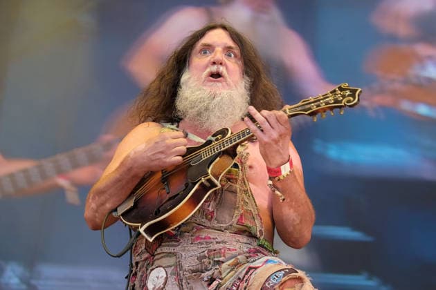 August 15, 2026, Williamscot, Oxfordshire, United Kingdom: English mandolin player and multi-instrumentalist Hippy Joe Hymas, also known as Joe Revolta performing live on stage at Fairport s Cropredy Convention with American Rockgrass band Hayseed Dixie. Formed in Nashville, Tennessee, in 2000,Hayseed Dixie is an American band that quoined the term rockgrass, which is hard rock and heavy metal songs played on traditional bluegrass instruments with. Their name is a parody of heavy metal band AC DC. The band consists of John Wheeler Barley Scotch on vocals, guitars, fiddle, keyboards, Hippy Joe Hymas on mandolin, acoustic guitar, vocals Jake Byers on bass, vocals Richard Collins on Banjo and vocals. Williamscot United Kingdom  - ZUMAs197 20260815_aaa_s197_194 Copyright: xDawnxFletcher-Parkx