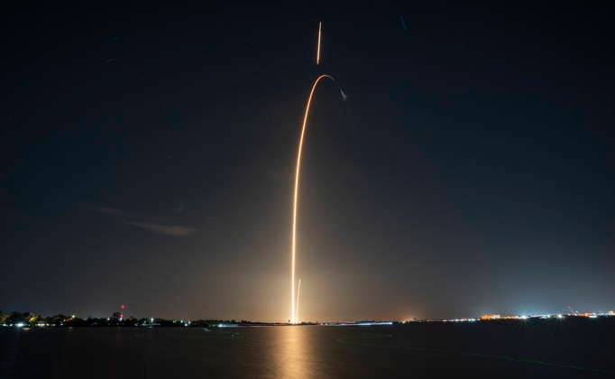 Timed exposure of the SpaceX Falcon 9 rocket as it launches eight satellites for GLobalstar at 9:12 PM from Launch Complex 40 at the Cape Canaveral Space Force Station, Florida on Saturday August 15, 2026. Captured in the image were the boost-back and landing burns. Eight minutes after launching the payload, the Falcon 9 first stage performed its fifth landing on Landing Zone 40 approximately 300 yards from the Launch Complex.  CCP20260815001 JOExMARINO