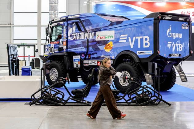 RUSSIA, REPUBLIC OF TATARSTAN - AUGUST 16, 2026: A woman walks past a Kamaz truck in the Kazan Expo International Exhibition Centre in Bolshiye Kabany during the 4th Sprouts Business Forum titled Sprouts: Russia and China – Mutually Beneficial Cooperation scheduled for 16-19 August 2026. Yevgeny Messman TASS Host Photo Agency  96243412