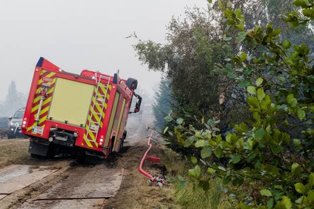 Emergency services pictured on the site, as a fire rages in the Hautes Fagnes (High Fens) nature reserve, on Sunday 16 August 2026 in Waimes. The fire started on August 14th and 2700 hectares (on a total of 4500) are impacted.  NICOLASxLAMBERT 183533024