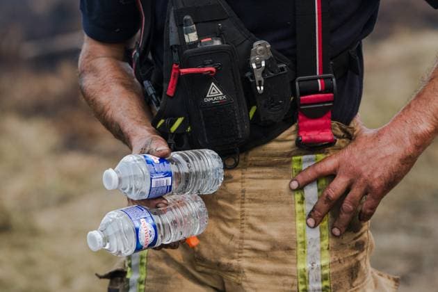 A firefighter talks to the press as a fire rages in the Hautes Fagnes (High Fens) nature reserve, on Sunday 16 August 2026 in Waimes. The fire started on August 14th and 2700 hectares (on a total of 4500) are impacted.  NICOLASxLAMBERT 183534440