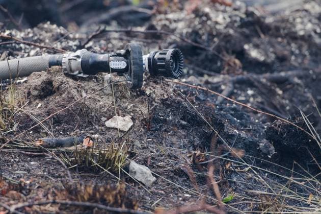 A fire hose pictured in a burned landscape, as a fire rages in the Hautes Fagnes (High Fens) nature reserve, on Sunday 16 August 2026 in Waimes. The fire started on August 14th and 2700 hectares (on a total of 4500) are impacted.  NICOLASxLAMBERT 183533911