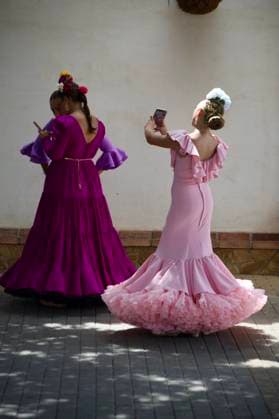 Scenes from the Málaga Fair: Several women dressed in flamenco gowns stroll through the Cortijo de Torres at the Málaga Fair. August 16, 2026, in Málaga, Andalusia, Spain. Locals and visitors enjoy the Málaga Fair at the fairgrounds. August 16, 2026, in Málaga, Andalusia, Málaga, Andalusia, Spain  Copyright: xÃlexxZeax 7716793