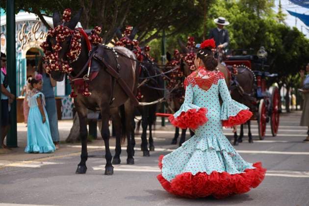 Scenes from the Málaga Fair: Several women dressed in flamenco gowns stroll through the Cortijo de Torres at the Málaga Fair. August 16, 2026, in Málaga, Andalusia, Spain. Locals and visitors enjoy the Málaga Fair at the fairgrounds. August 16, 2026, in Málaga, Andalusia, Málaga, Andalusia, Spain  Copyright: xÃlexxZeax 7716794