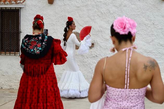 Scenes from the Málaga Fair: Several women dressed in flamenco gowns stroll through the Cortijo de Torres at the Málaga Fair. August 16, 2026, in Málaga, Andalusia, Spain. Locals and visitors enjoy the Málaga Fair at the fairgrounds. August 16, 2026, in Málaga, Andalusia, Málaga, Andalusia, Spain  Copyright: xÃlexxZeax 7716788