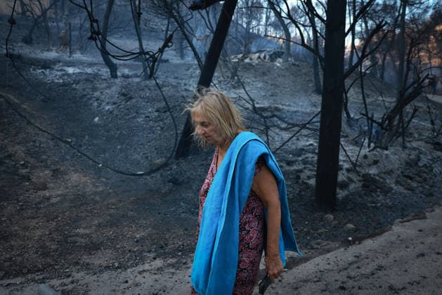 Wildfire kills 2 on Greek island of Salamina near Athens ATHENS, GREECE - AUGUST 16: A woman is seen among the brunt forested area after a wildfire broke out on the island of Salamina, west of Athens, Greece, on August 16, 2026. Two people were found dead in a forested area of Peristeria on the Greek island of Salamina, where a wildfire broke out around noon Sunday, local media reported. Costas Baltas Anadolu Athens Greece. Editorial use only. Please get in touch for any other usage.  Copyright: x2026xAnadoluxCostasxBaltasx