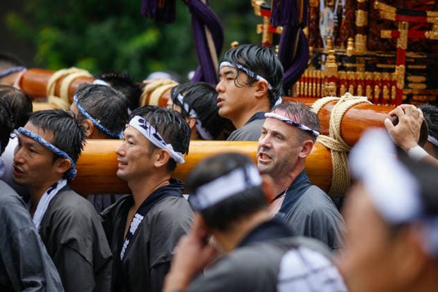 August 16, 2026, Tokyo, Japan: Participants seen carrying a heavily decorated mikoshi (portable shrine) in Koto Ward during the Fukagawa Hachiman Festival. The triennial festival is one of Tokyo s top three major Edo-period festivals held at Tomioka Hachimangu Shrine. It is well known as the Water-Splashing Festival (Mizukake Matsuri), where participants toss gallons of purifying water onto shrine bearers to beat the intense midsummer heat and bless the local community. Tokyo Japan - ZUMAs197 20260816_aaa_s197_074 Copyright: xRodrigoxReyesxMarinx