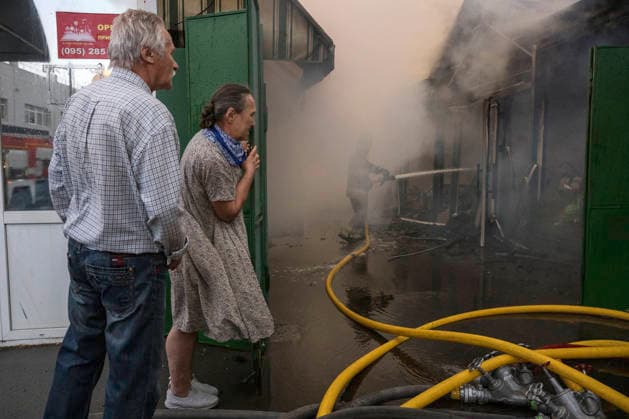 Russian Attack Destroys Ukraine s Largest Book Market In Kyiv Shop owners at a book market try to save their belongings from a fire that broke out following an overnight Russian missile and drone attack in Kyiv, Ukraine, on August 16, 2026. Two people were reported injured. Kyiv Ukraine  Copyright: xMaxymxMarusenkox originalFilename: musiienko-notitle260816_nppgC.jpg