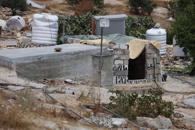 August 16, 2026, Masafer Yatta, Palestine, State of: MASAFER YATTA, WEST BANK, PALESTINE, AUGUST 16, 2026: Palestinian Abdullah Dababseh holds his phone displaying a demolition order issued by the Israeli army for the cave where he lives in Khirbet Khallet Al-Dabaa, south of Hebron. According to local residents, demolition orders were issued for three homes, three caves, a school, trees and crops in the area. Residents said the village was demolished in May 2025, forcing some Palestinians to live in caves. Masafer Yatta Palestine, State of - ZUMAq101 20260816_zna_q101_086 Copyright: xMosabxShawerx