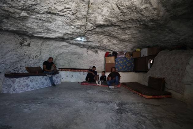 August 16, 2026, Masafer Yatta, Palestine, State of: MASAFER YATTA, WEST BANK, PALESTINE, AUGUST 16, 2026: Palestinian Abdullah Dababseh holds his phone displaying a demolition order issued by the Israeli army for the cave where he lives in Khirbet Khallet Al-Dabaa, south of Hebron. According to local residents, demolition orders were issued for three homes, three caves, a school, trees and crops in the area. Residents said the village was demolished in May 2025, forcing some Palestinians to live in caves. Masafer Yatta Palestine, State of - ZUMAq101 20260816_zna_q101_103 Copyright: xMosabxShawerx