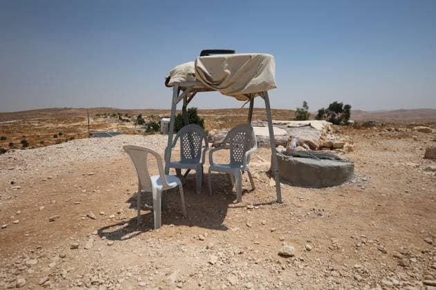 August 16, 2026, Masafer Yatta, Palestine, State of: MASAFER YATTA, WEST BANK, PALESTINE, AUGUST 16, 2026: Palestinian Abdullah Dababseh holds his phone displaying a demolition order issued by the Israeli army for the cave where he lives in Khirbet Khallet Al-Dabaa, south of Hebron. According to local residents, demolition orders were issued for three homes, three caves, a school, trees and crops in the area. Residents said the village was demolished in May 2025, forcing some Palestinians to live in caves. Masafer Yatta Palestine, State of  - ZUMAq101 20260816_zna_q101_111 Copyright: xMosabxShawerx