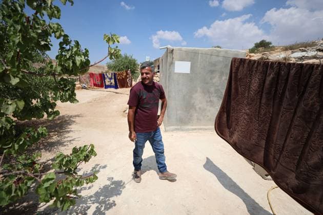 August 16, 2026, Masafer Yatta, Palestine, State of: MASAFER YATTA, WEST BANK, PALESTINE, AUGUST 16, 2026: Palestinian Abdullah Dababseh holds his phone displaying a demolition order issued by the Israeli army for the cave where he lives in Khirbet Khallet Al-Dabaa, south of Hebron. According to local residents, demolition orders were issued for three homes, three caves, a school, trees and crops in the area. Residents said the village was demolished in May 2025, forcing some Palestinians to live in caves. Masafer Yatta Palestine, State of - ZUMAq101 20260816_zna_q101_105 Copyright: xMosabxShawerx