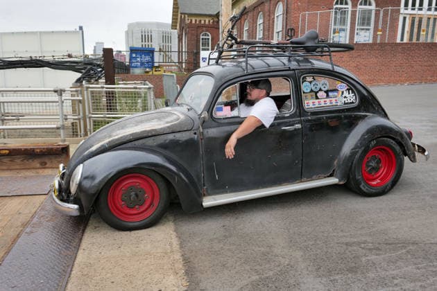 August 16, 2026, New York, New York, USA: Bettle on way to ferry at VW Gridlock on Governors Island. The vintage Volkswagen show returned to .the island across from the Lower Manhattan skyline. The collection of about 75 vintage epic.Volkswagens from across the years with models the Beetle, Bus, Karmann Ghia and Thing .were parked along the waterside at Picnic Point for visitors to enjoy, admire and photograph. New York USA  - ZUMAh156 20260816_znp_h156_017 Copyright: xMiloxHessx