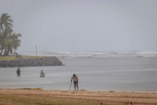 August 16, 2026, Honolulu, Hawaii, U.S: A lone scavenger hunter works along Ala Moana Beach in Honolulu after Hurricane Lala struck Hawaii in the early morning hours of Sunday, August 16, 2026. The area is a popular location for tourists who typically flock to the beach in the hundreds, but widespread flooding and power outages plagued the area following the high winds and rain brought by the hurricane. Honolulu U.S  - ZUMAd149 20260816_zap_d149_002 Copyright: xJamesxD.xDeCampx