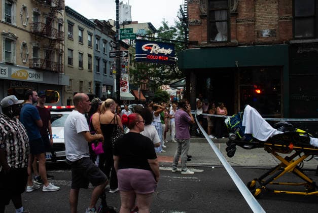 August 16, 2026, New York City, New York, USA: NYPD officers shot and killed a man they said was armed with a butcher s knife inside an apartment building on the Lower East Side Sunday, August 16th, 2026 afternoon. Officers were called out to the building for reports of an assault. When they got there, they said they found a blood trail on the stairs. Officers followed the blood trail, and found a man, identified as 54-year-old Wei Chan, who they said was armed with a butcher s knife. According to the department, officers ordered Chan to show his hands multiple times, and he refused. That s when officers shot Chan. .Wei Chan was taken to a nearby hospital where he was later pronounced dead. The shooting happened around 4 p.m. at a building  - ZUMAt442 20260816_znp_t442_002 Copyright: xBillyxTompkinsx
