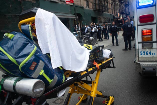 August 16, 2026, New York City, New York, USA: NYPD officers shot and killed a man they said was armed with a butcher s knife inside an apartment building on the Lower East Side Sunday, August 16th, 2026 afternoon. Officers were called out to the building for reports of an assault. When they got there, they said they found a blood trail on the stairs. Officers followed the blood trail, and found a man, identified as 54-year-old Wei Chan, who they said was armed with a butcher s knife. According to the department, officers ordered Chan to show his hands multiple times, and he refused. That s when officers shot Chan. .Wei Chan was taken to a nearby hospital where he was later pronounced dead. The shooting happened around 4 p.m. at a building  - ZUMAt442 20260816_znp_t442_003 Copyright: xBillyxTompkinsx