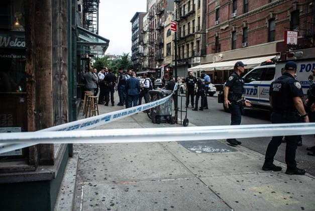 August 16, 2026, New York City, New York, USA: NYPD officers shot and killed a man they said was armed with a butcher s knife inside an apartment building on the Lower East Side Sunday, August 16th, 2026 afternoon. Officers were called out to the building for reports of an assault. When they got there, they said they found a blood trail on the stairs. Officers followed the blood trail, and found a man, identified as 54-year-old Wei Chan, who they said was armed with a butcher s knife. According to the department, officers ordered Chan to show his hands multiple times, and he refused. That s when officers shot Chan. .Wei Chan was taken to a nearby hospital where he was later pronounced dead. The shooting happened around 4 p.m. at a building  - ZUMAt442 20260816_znp_t442_005 Copyright: xBillyxTompkinsx