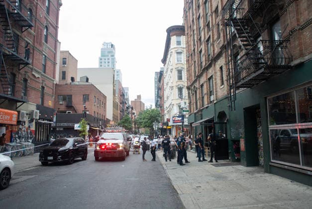 August 16, 2026, New York City, New York, USA: NYPD officers shot and killed a man they said was armed with a butcher s knife inside an apartment building on the Lower East Side Sunday, August 16th, 2026 afternoon. Officers were called out to the building for reports of an assault. When they got there, they said they found a blood trail on the stairs. Officers followed the blood trail, and found a man, identified as 54-year-old Wei Chan, who they said was armed with a butcher s knife. According to the department, officers ordered Chan to show his hands multiple times, and he refused. That s when officers shot Chan. .Wei Chan was taken to a nearby hospital where he was later pronounced dead. The shooting happened around 4 p.m. at a building - ZUMAt442 20260816_znp_t442_001 Copyright: xBillyxTompkinsx