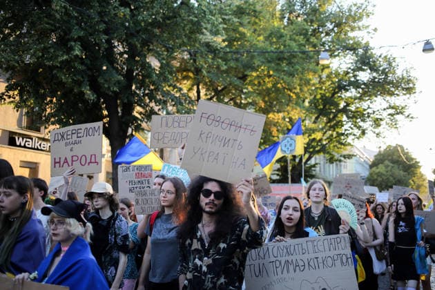 August 16, 2026, Odessa, Ukraine: Activists hold placards expressing their opinions and Ukrainian flags on during the rally Deribasovskaya Street. A march in support of former Defense Minister Fedorov passed through the central streets of Odessa. Activists are demanding that Mykhailo Fedorov should be reinstated as Defense Minister. He was dismissed a month ago by the Ukrainian president. Similar marches have taken place across Ukraine. Odessa Ukraine  - ZUMAs197 20260816_aaa_s197_222 Copyright: xViacheslavxOnyshchenkox