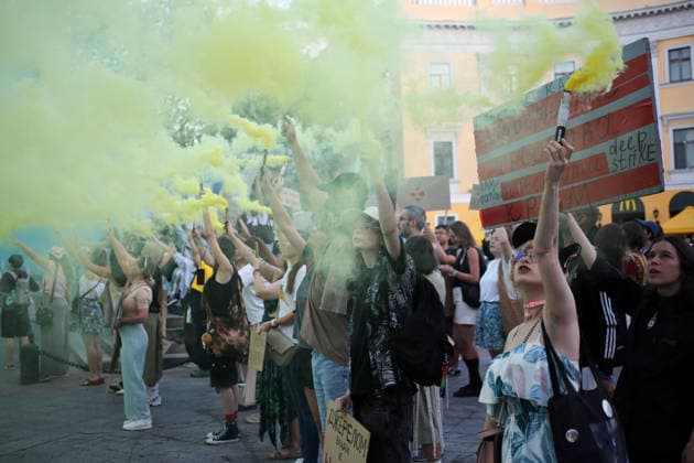 August 16, 2026, Odessa, Ukraine: Activists hold smoke flares in the colors of the Ukrainian national flag during the rally near the Duke de Richelieu monument. A march in support of former Defense Minister Fedorov passed through the central streets of Odessa. Activists are demanding that Mykhailo Fedorov should be reinstated as Defense Minister. He was dismissed a month ago by the Ukrainian president. Similar marches have taken place across Ukraine. Odessa Ukraine - ZUMAs197 20260816_aaa_s197_217 Copyright: xViacheslavxOnyshchenkox
