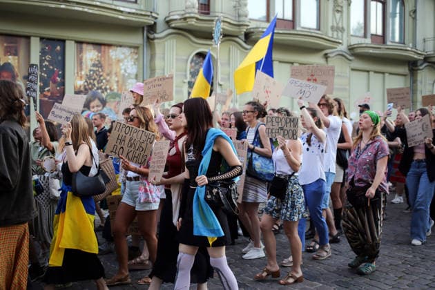 August 16, 2026, Odessa, Ukraine: Activists hold placards expressing their opinions and Ukrainian flags on during the rally Deribasovskaya Street. A march in support of former Defense Minister Fedorov passed through the central streets of Odessa. Activists are demanding that Mykhailo Fedorov should be reinstated as Defense Minister. He was dismissed a month ago by the Ukrainian president. Similar marches have taken place across Ukraine. Odessa Ukraine - ZUMAs197 20260816_aaa_s197_219 Copyright: xViacheslavxOnyshchenkox