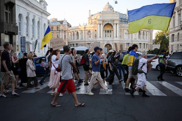August 16, 2026, Odessa, Ukraine: Activists hold placards expressing their opinions and Ukrainian flags on during the rally Deribasovskaya Street. A march in support of former Defense Minister Fedorov passed through the central streets of Odessa. Activists are demanding that Mykhailo Fedorov should be reinstated as Defense Minister. He was dismissed a month ago by the Ukrainian president. Similar marches have taken place across Ukraine. Odessa Ukraine - ZUMAs197 20260816_aaa_s197_220 Copyright: xViacheslavxOnyshchenkox