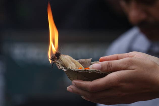 August 17, 2026, Kathmandu, Bagmati, Nepal: The Naag Panchami festival is being celebrated today with traditional worship and offerings to serpents. Observed annually on the fifth day of the bright fortnight of the month of Shrawan, this festival involves pasting images of serpents on the main entrance of homes and visiting serpent ponds (Naagdah) for worship. A woman praying to the Serpent Deity. Kathmandu Nepal  - ZUMAa308 20260817_znp_a308_015 Copyright: xChandraxBahadurxAlex