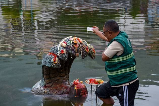 August 17, 2026, Kathmandu, Nepal: KATHMANDU, NEPAL Ã¢â‚¬ AUGUST 17, 2026: Hindu devotees offer prayers to a statue representing Nag, a serpent deity, at Taudaha Pond in Kathmandu, Nepal, on August 17, 2026, during celebrations of Nag Panchami. The Hindu festival, observed during the monsoon season, is dedicated to the worship of serpent deities, with devotees making prayers and ritual offerings. Kathmandu Nepal - ZUMAq101 20260817_zna_q101_002 Copyright: xSunilxPradhanx