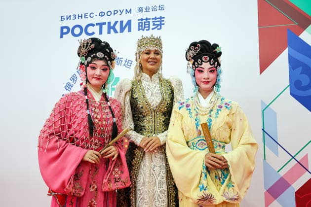 RUSSIA, REPUBLIC OF TATARSTAN - AUGUST 17, 2026: Women wear traditional dresses during the 2026 Russia-China Business Forum titled Sprouts: Russia and China – Mutually Beneficial Cooperation and held at the Kazan Expo International Exhibition Centre in Bolshiye Kabany, southeast of Kazan. Yevgeny Messman TASS Host Photo  96293586
