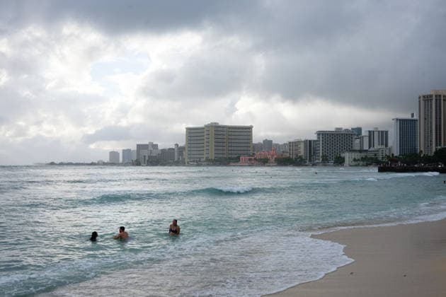 August 16, 2026, Honolulu, Hawaii, USA: Tropical storm LalaÃ¢â‚¬â ¢s worst affected Oahu and Waikiki beginning after 1:00 a.m. Sunday August 16, 2026 and lasted, tapering, through mid-afternoon leaving behind flooding, downed trees, and more than 130,000 Hawaiian Electric customers without power at 4:00 p.m. But at sunset Waikiki Beach was packed with people taking advantage of a brief respite from the rain that the National Weather Service forecasts will last through the week as the slow-moving storm moves Northwest beneath the Hawaiian archipelago. Schools, government offices and many businesses will remain closed on Monday as people on OÃ¢â‚¬Ëœahu sort through the stormÃ¢â‚¬â ¢s consequences. Honolulu USA  - ZUMAm255 20260816_znp_m255_011 Copyright: xJ.xMattx