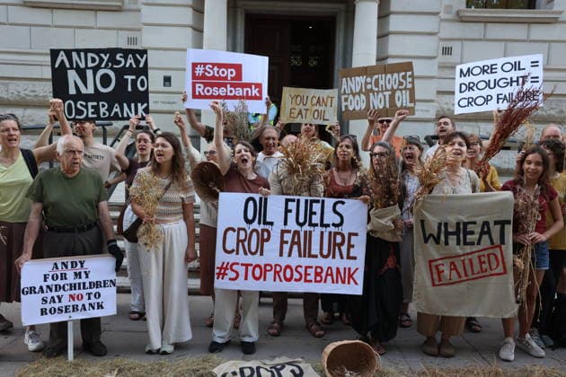Fossil Free London Crop Failure Protest outside the Treasury, London, UK 17 August 2026 Campaigners stage a protest outside the Treasury on Horse Guards Road, London, UK, on 17 August 2026, calling on Prime Minister Andy Burnham to reject the Rosebank oil field as the public consultation closes. Holding empty harvesting baskets and hessian bags labelled Wheat - Failed , the protesters highlight the connection between fossil fuel extraction and the crop failures resulting from climate-driven heatwaves and droughts., Credit:PETE SPELLER Avalon UK, London  Copyright: xPETExSPELLERx xAvalonx 1124555488