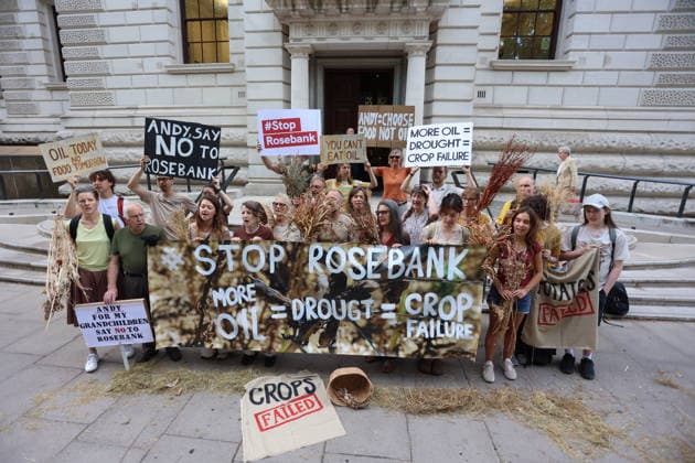 Fossil Free London Crop Failure Protest outside the Treasury, London, UK 17 August 2026 Campaigners stage a protest outside the Treasury on Horse Guards Road, London, UK, on 17 August 2026, calling on Prime Minister Andy Burnham to reject the Rosebank oil field as the public consultation closes. Holding empty harvesting baskets and hessian bags labelled Wheat - Failed , the protesters highlight the connection between fossil fuel extraction and the crop failures resulting from climate-driven heatwaves and droughts., Credit:PETE SPELLER Avalon UK, London  Copyright: xPETExSPELLERx xAvalonx 1124555515