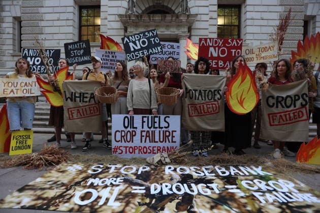 Fossil Free London Crop Failure Protest outside the Treasury, London, UK 17 August 2026 Campaigners stage a protest outside the Treasury on Horse Guards Road, London, UK, on 17 August 2026, calling on Prime Minister Andy Burnham to reject the Rosebank oil field as the public consultation closes. Holding empty harvesting baskets and hessian bags labelled Wheat - Failed , the protesters highlight the connection between fossil fuel extraction and the crop failures resulting from climate-driven heatwaves and droughts., Credit:PETE SPELLER Avalon UK, London  Copyright: xPETExSPELLERx xAvalonx 1124555574