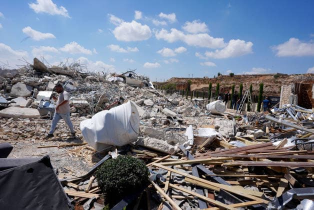 Israeli forces demolish two-story Palestinian house in East Jerusalem EAST JERUSALEM - AUGUST 17: Palestinians inspect the damage and rubble after Israeli forces demolished a two-story Palestinian-owned residential building in Qalandiya town, northwest of East Jerusalem, on August 17, 2026. The demolition left at least 15 Palestinians homeless. Issam Rimawi Anadolu Jerusalem Israel. Editorial use only. Please get in touch for any other usage.  Copyright: x2026xAnadoluxIssamxRimawix