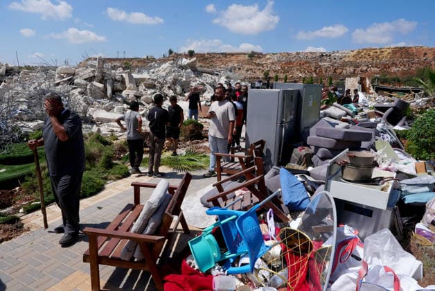 Israeli forces demolish two-story Palestinian house in East Jerusalem EAST JERUSALEM - AUGUST 17: Palestinians inspect the damage and rubble after Israeli forces demolished a two-story Palestinian-owned residential building in Qalandiya town, northwest of East Jerusalem, on August 17, 2026. The demolition left at least 15 Palestinians homeless. Issam Rimawi Anadolu Jerusalem Israel. Editorial use only. Please get in touch for any other usage.  Copyright: x2026xAnadoluxIssamxRimawix