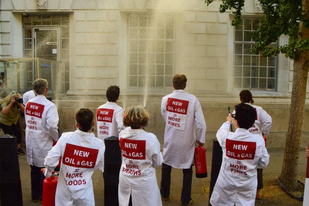 August 17, 2026, London, England, United Kingdom: Climate activists from the group Scientists On Survival spray the Department for Energy Security and Net Zero (DESNZ) in Westminster with water using fire extinguishers in protest against Rosebank, as the public consulation on the North Sea oil and gas field concludes. London United Kingdom - ZUMAv130 20260817_zip_v130_001 Copyright: xVukxValcicx