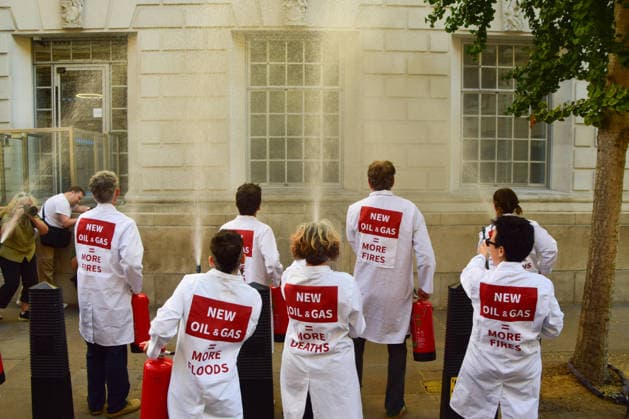 August 17, 2026, London, England, United Kingdom: Climate activists from the group Scientists On Survival spray the Department for Energy Security and Net Zero (DESNZ) in Westminster with water using fire extinguishers in protest against Rosebank, as the public consulation on the North Sea oil and gas field concludes. London United Kingdom - ZUMAv130 20260817_zip_v130_003 Copyright: xVukxValcicx