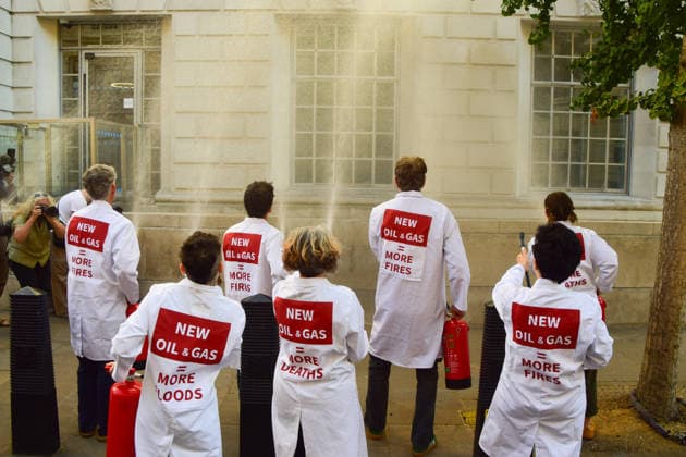 August 17, 2026, London, England, United Kingdom: Climate activists from the group Scientists On Survival spray the Department for Energy Security and Net Zero (DESNZ) in Westminster with water using fire extinguishers in protest against Rosebank, as the public consulation on the North Sea oil and gas field concludes. London United Kingdom - ZUMAv130 20260817_zip_v130_022 Copyright: xVukxValcicx