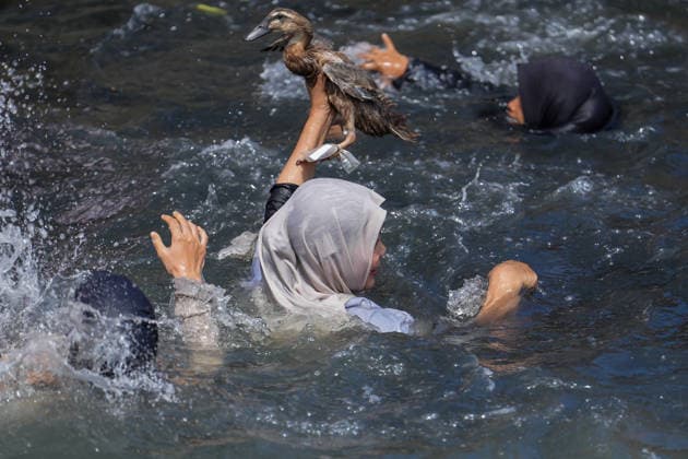 August 17, 2026, Banda Aceh, Aceh, Indonesia: Residents competed to catch ducks in the waters of the Lampaseh River in Banda Aceh, Aceh Province, Indonesia, on Monday. The competition, which involved dozens of children and adultsÃ¢â‚¬both male and femaleÃ¢â‚¬was one of the traditional games organized to celebrate the 81st anniversary of the Republic of Indonesia s independence. Banda Aceh Indonesia  - ZUMAi115 20260817_zip_i115_035 Copyright: xMuhammadxIqbalx