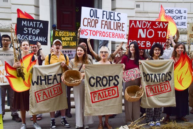 August 17, 2026, London, England, United Kingdom: Climate activists from the group Fossil Free London gather outside the Treasury in Westminster in protest against Rosebank, as the public consulation on the North Sea oil and gas field concludes. The activists highlighted crop failures amidst the ongoing drought, heatwaves and fires. London United Kingdom - ZUMAv130 20260817_zip_v130_034 Copyright: xVukxValcicx